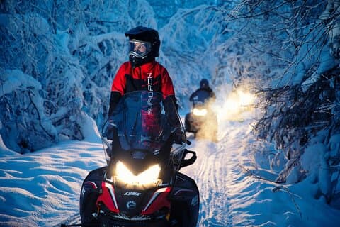 Evening snowmobile adventure in Rovaniemi