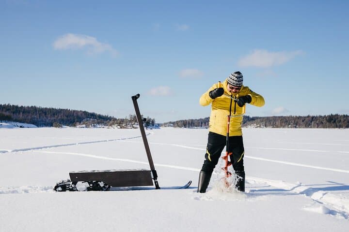 Drill hole through ice