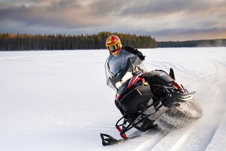 Snowmobiles and Huskies
