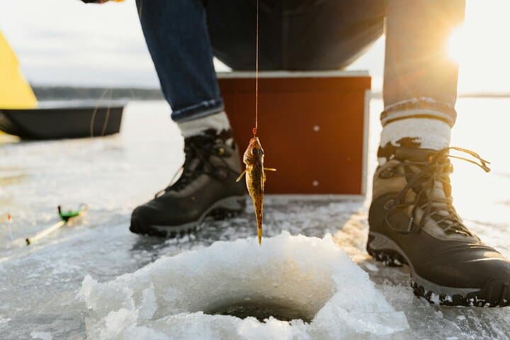 Ice Fishing Adventure in Lapland's Arctic Wilderness in Levi