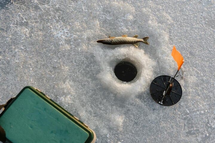 Ice Fishing Adventure in Lapland's Arctic Wilderness in Levi