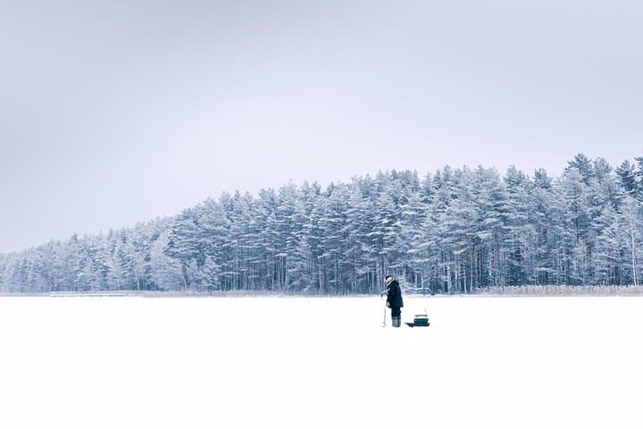 Ice Fishing Adventure in Lapland's Arctic Wilderness in Levi