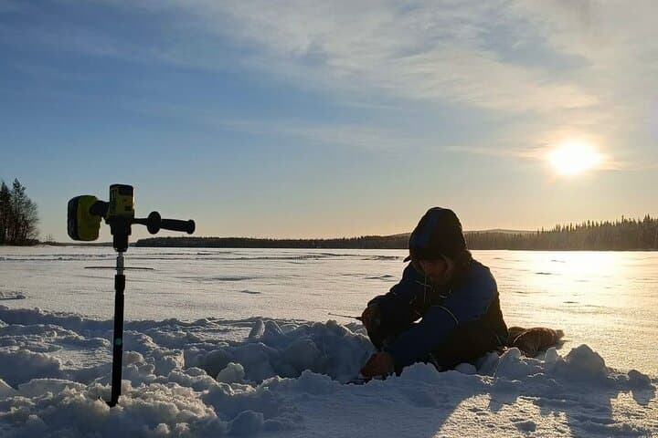 Lapland Winter Adventure Snowmobiling and Ice Fishing Experience