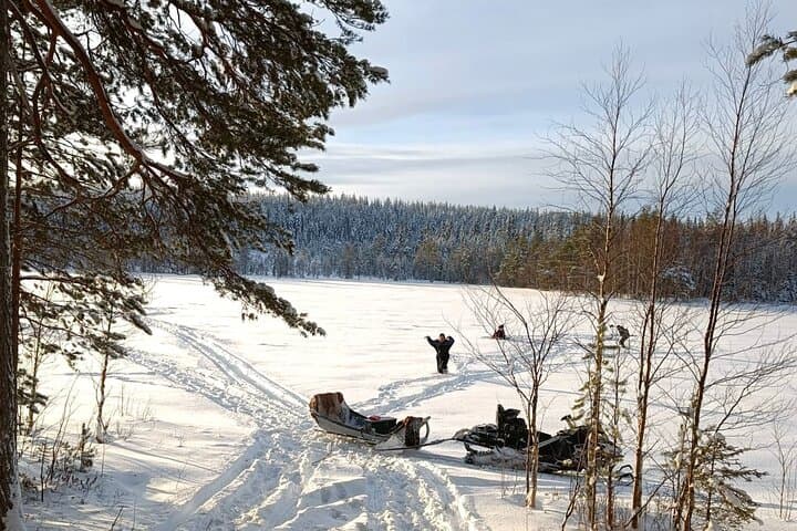 Lapland Winter Adventure Snowmobiling and Ice Fishing Experience