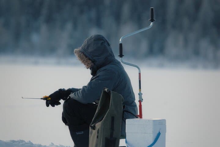 Ice Fishing Adventure in Lapland's Arctic Wilderness in Levi