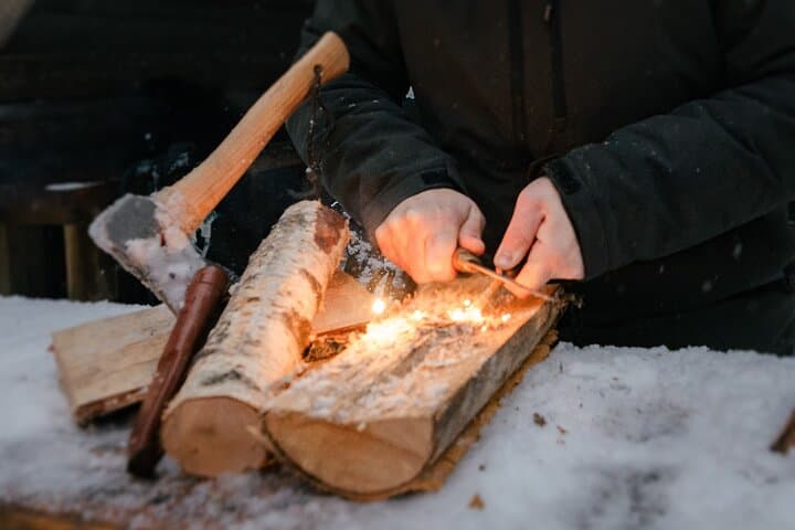Lighting the campfire with birch wood in Lapland