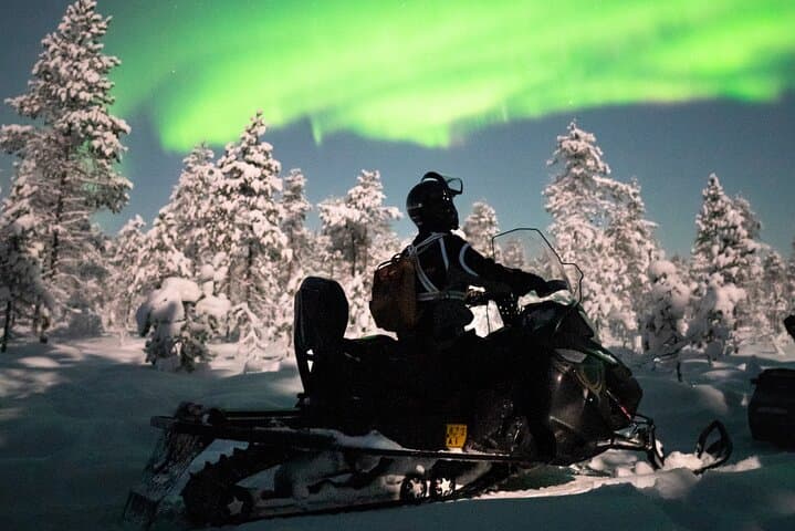Northern lights safari by snowmobile