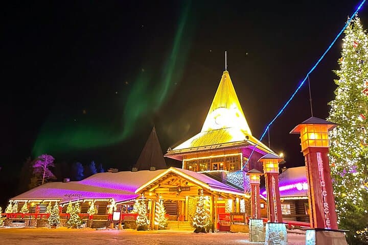 A magical moment captured as Northern Lights are seen upon Santa Claus Office building at Arctic Circle in Rovaniemi, Lapland.
