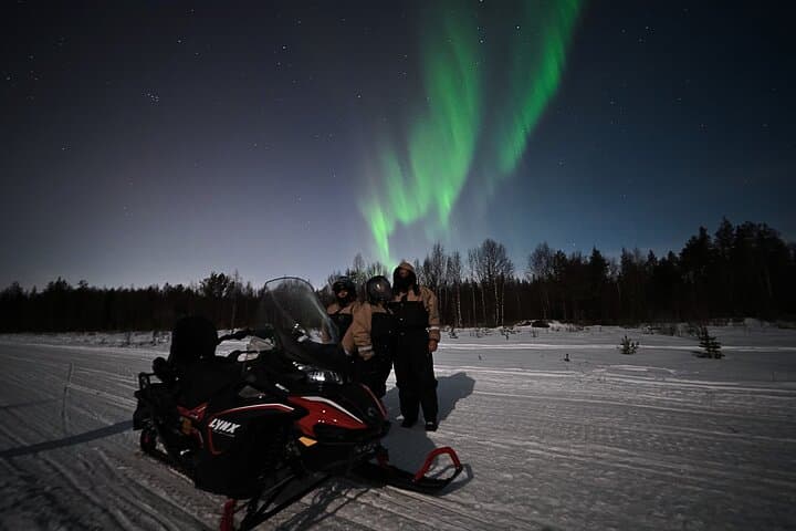 Arctic Aurora Chase by Snowmobile
