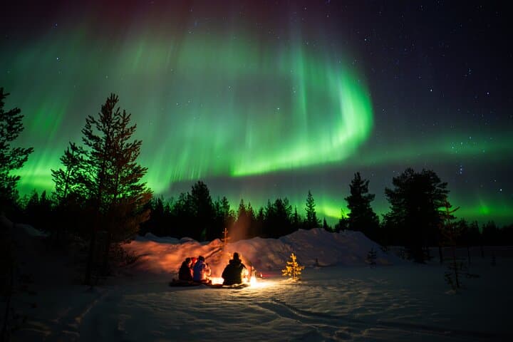 Northern lights and campfire